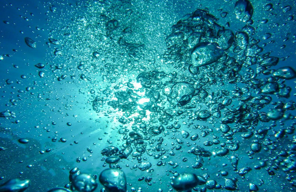 Hoe diep moet je een regenwatertank ingraven in je tuin?